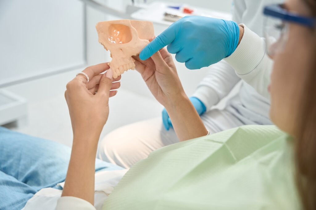 dentist in Katy TX demonstrating cracked tooth treatment options during a consultation