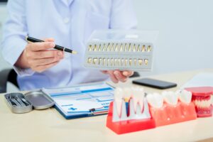 Dentist in Katy TX explaining cosmetic dental treatment options including veneers and teeth whitening