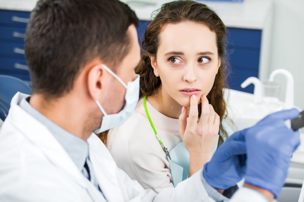 dentist in Katy TX examining a patient’s gums for early signs of gum disease