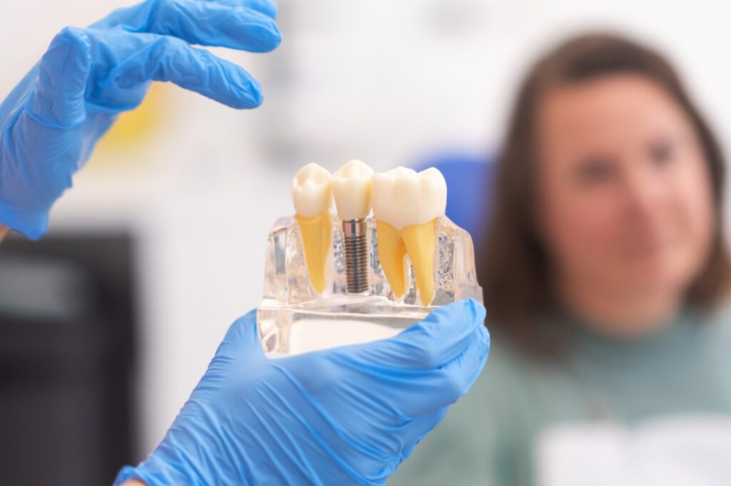 dentist in Katy TX discussing dental implant treatment with patient