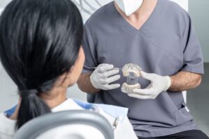 dentist in Katy TX explaining dental crowns and bridges during consultation
